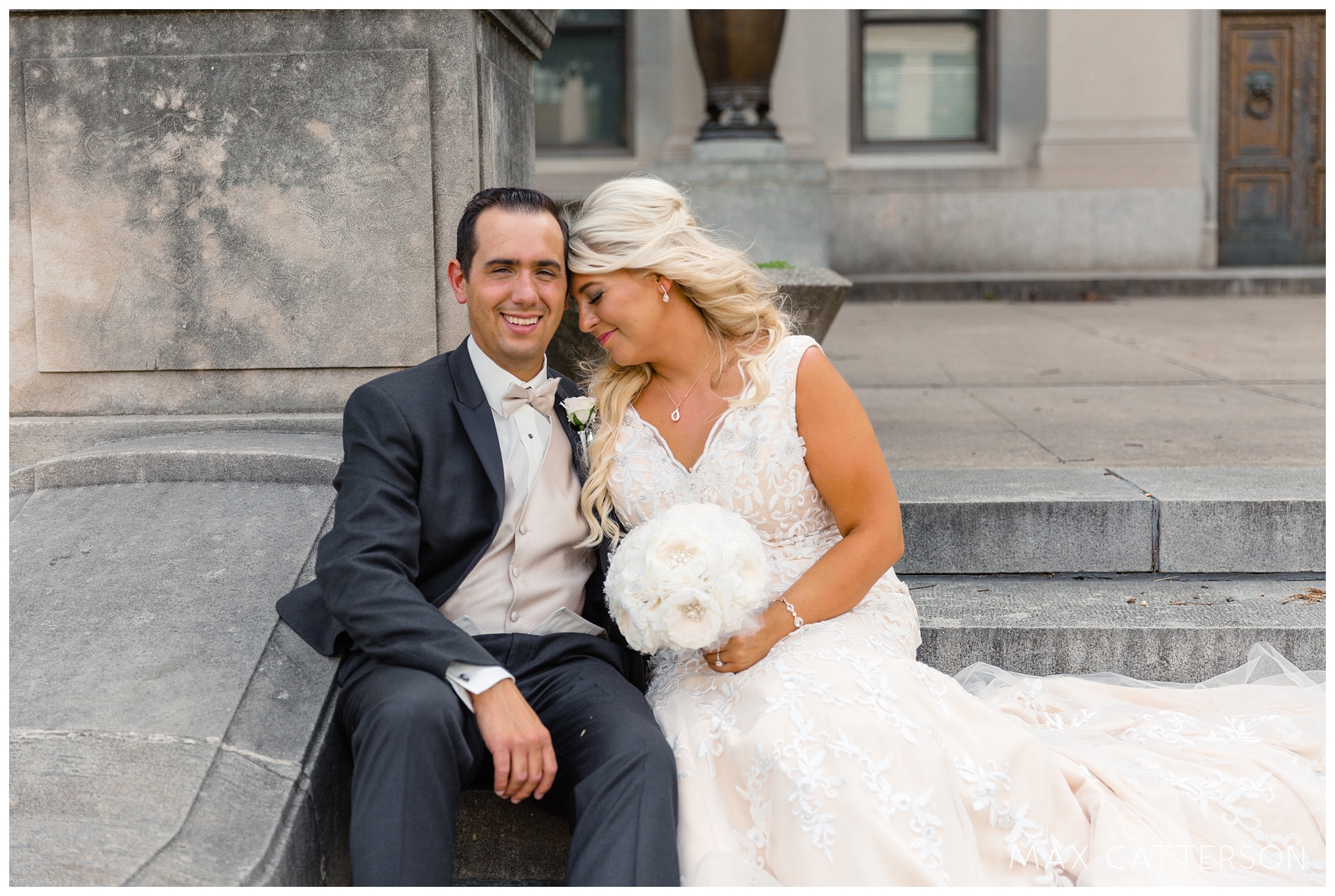 bride and groom on steps