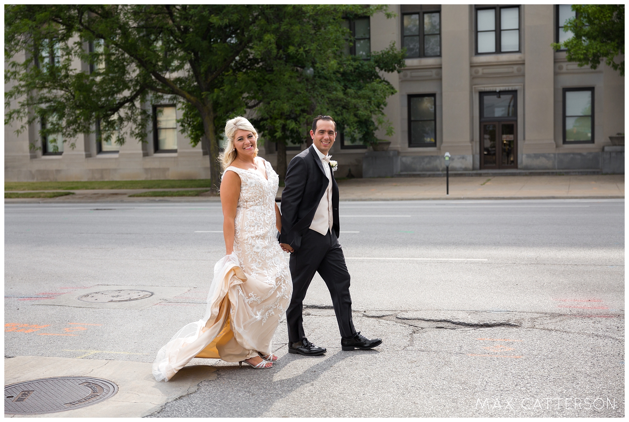 bride and groom crossing the street