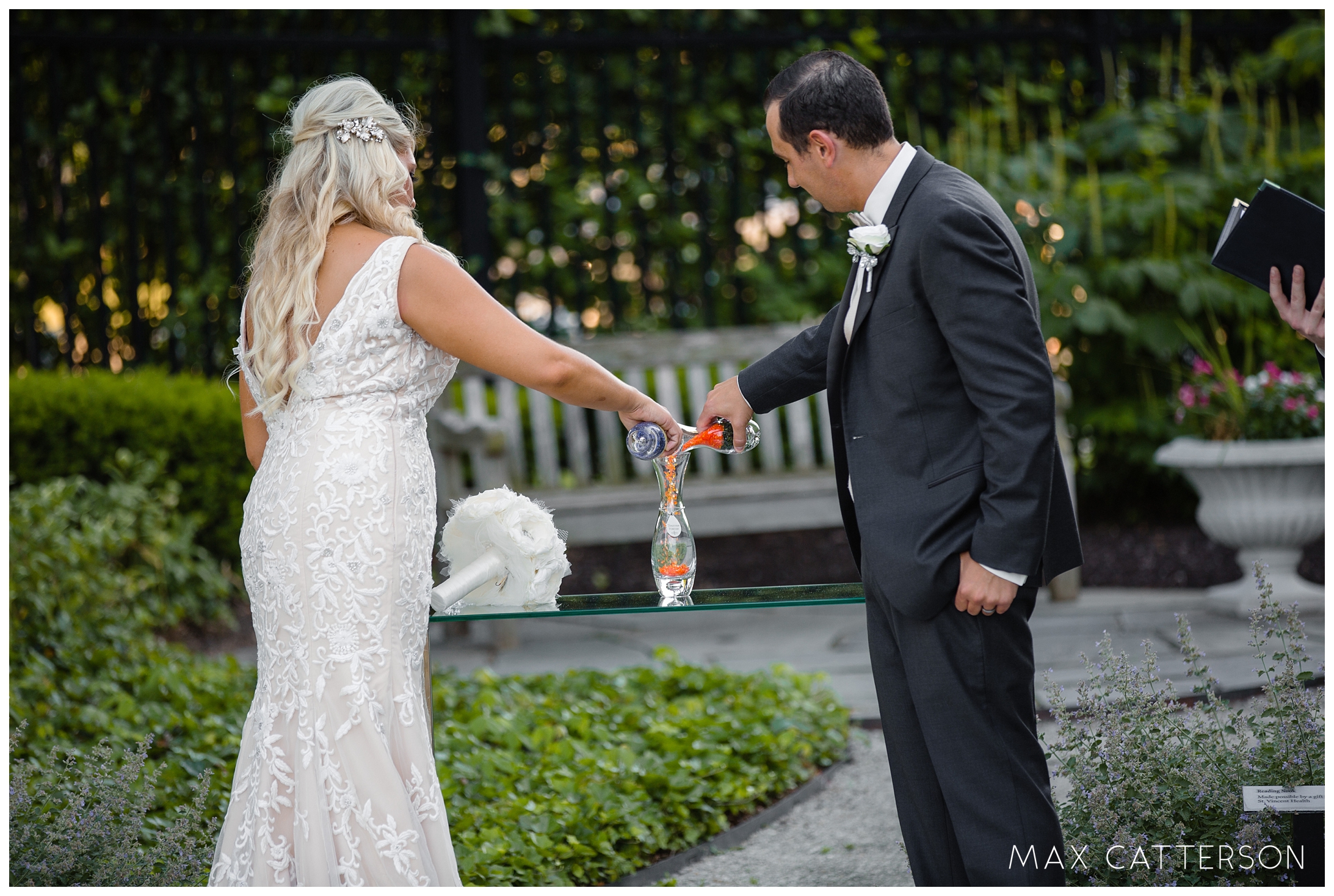 bride and groom pouring sand