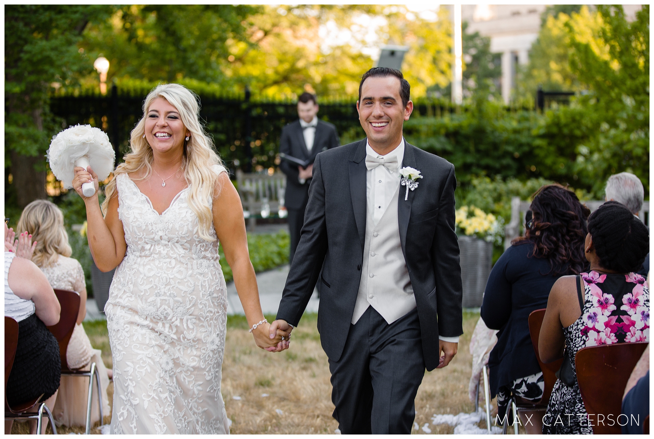 newlyweds walking down the isle together