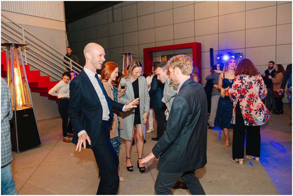 Gay couple dancing at a wedding